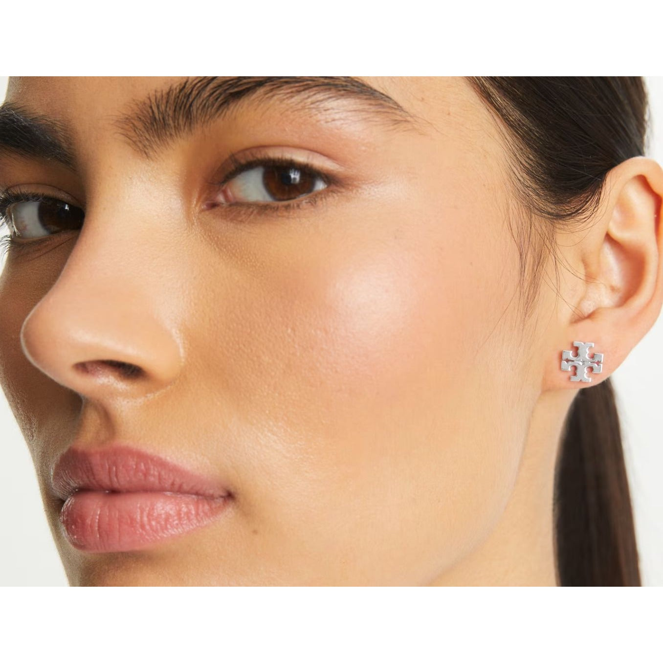 both. Tory Burch Gold Kira Logo Stud Earrings